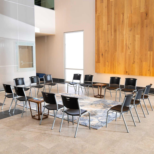Lifetime 14 Pack Stacking Chair arranged in circular seating layout inside modern lobby space