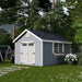 10x16 gray Colonial Williamsburg Shed with white double doors and window box, set in a lush green backyard.