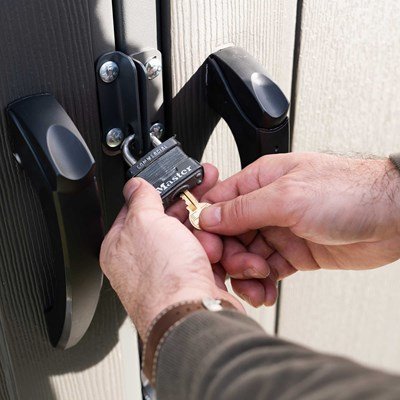 Close-up of a padlock securing the Lifetime storage shed's lockable steel-reinforced door.