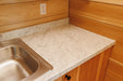 Detailed view of the marble countertop in the Firestack Cabin kitchen.