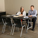 Conference table setup with Lifetime 4 Pack Stacking Chairs arranged for office meeting use.