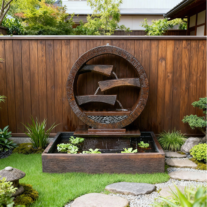 Modern circular cascading outdoor water fountain in brown resin finish with tiered spouts and square basin, styled in a serene backyard garden setting.
