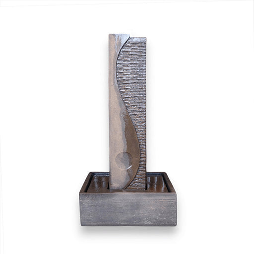 Modern gray Yang water fountain isolated on white background featuring curved textured column and square water basin base.