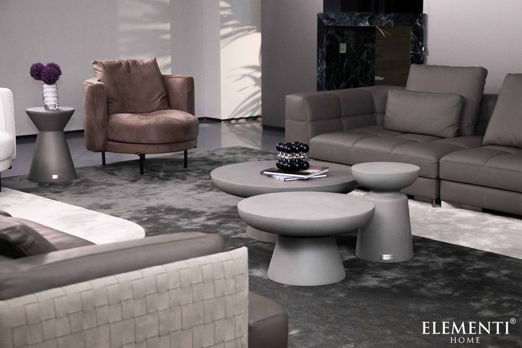 Elementi Kylix Series medium coffee tables in space grey arranged in a stylish modern living room, with surrounding sofas.