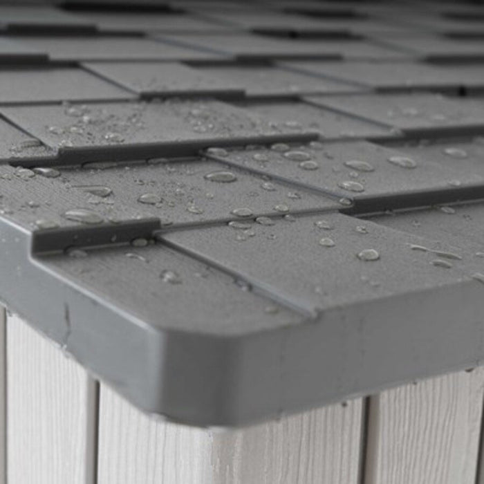 Close-up of the Lifetime Modern Shed's roof shingle corner detail with water droplets.