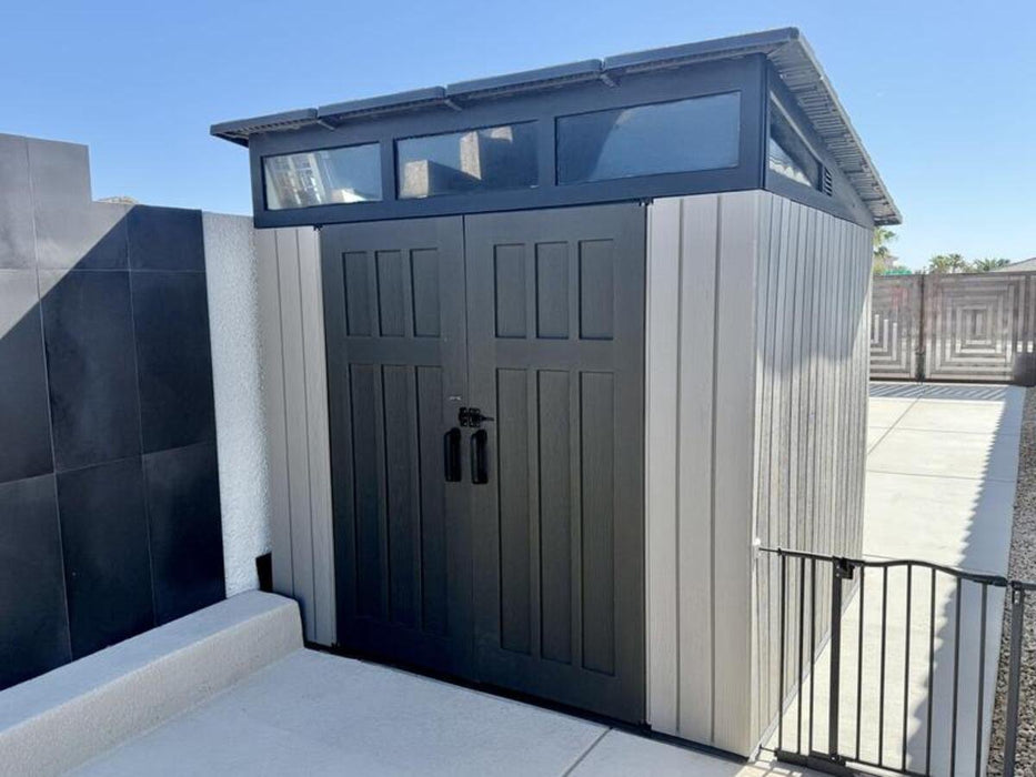 Lifetime Modern Shed installed on a modern tile patio, front angle view with closed doors.