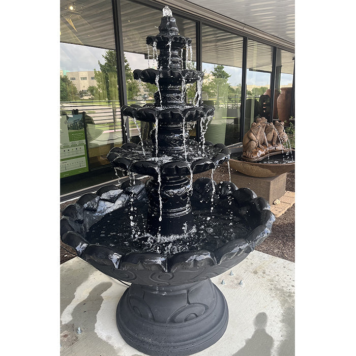 Monaco black finish tiered patio water fountain with cascading streams and large scalloped basin on a concrete surface display