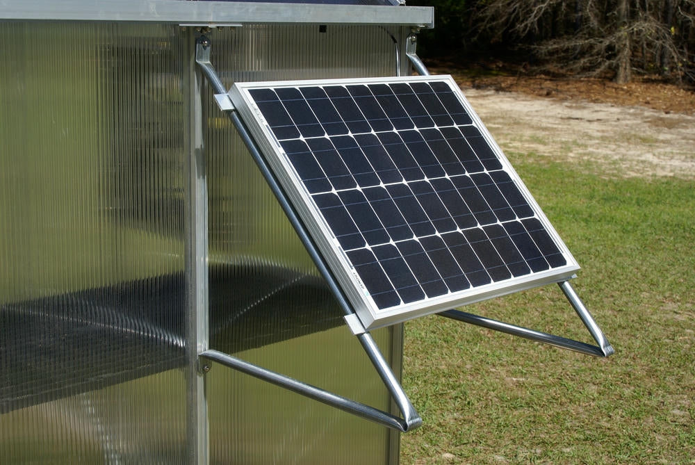 Solar panel mounted on greenhouse exterior powering the Riverstone MONT Solar Powered Ventilation System.
