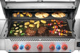 Top-down view of Napoleon Grills Prestige® 665 RSIB grilling steaks, corn, veggies, and naan with a probe inserted