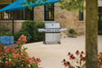 Napoleon Grills Prestige® 665 RSIB set up on a spacious stone patio surrounded by plants