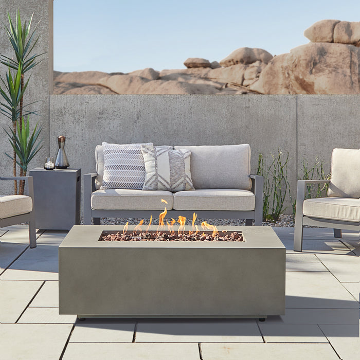 Aegean 50" Real Flame fire pit table compatible with natural gas, shown in outdoor setting