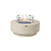 Studio shot of the Elementi Plus Nimes round concrete fire pit table, frosted cream white, lit flame with glass guard on white background