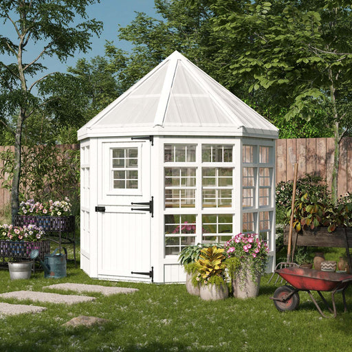 Little Cottage Co. Octagon Greenhouse displayed in a garden setting with flowers and greenery.