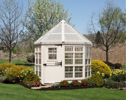 The Octagon Greenhouse by Little Cottage Company in a garden setting.