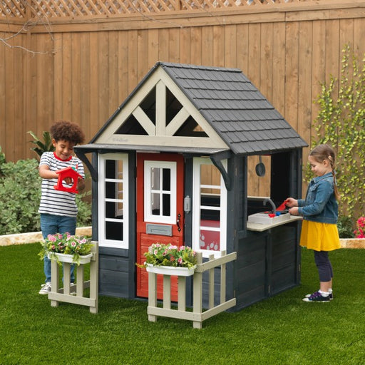 Wooden Lakeside Bungalow Playhouse in the backyard with kids