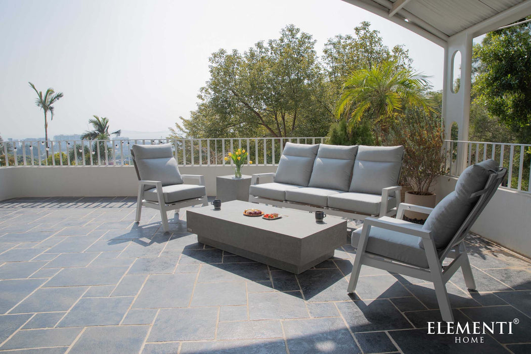 A spacious balcony setup featuring the Elementi Tevere Series Rectangle Coffee Table in Space Grey, surrounded by comfortable grey seating.