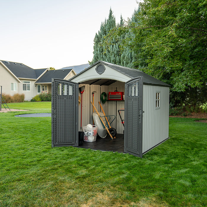 Open Lifetime 8x10 Shed filled with garden tools and equipment, showcasing storage capabilities and interior layout.