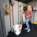 Interior of the Lifetime 8x10 Shed showing organized storage with garden tools, demonstrating the practical use of space.