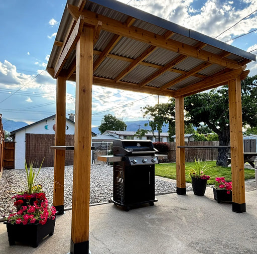 Covered BBQ area with Outdoor Living Today grill gazebo 8x5 featuring cedar posts and corrugated metal roof