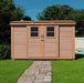 Natural wood finish on Outdoor Living Today 12x4 shed with dual sliding doors on a grassy backyard.
