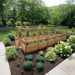 Western red cedar Garden in a Box with Deer Fence 8x16 in a landscaped yard, gate ajar beside hydrangeas, hostas and dwarf blue junipers