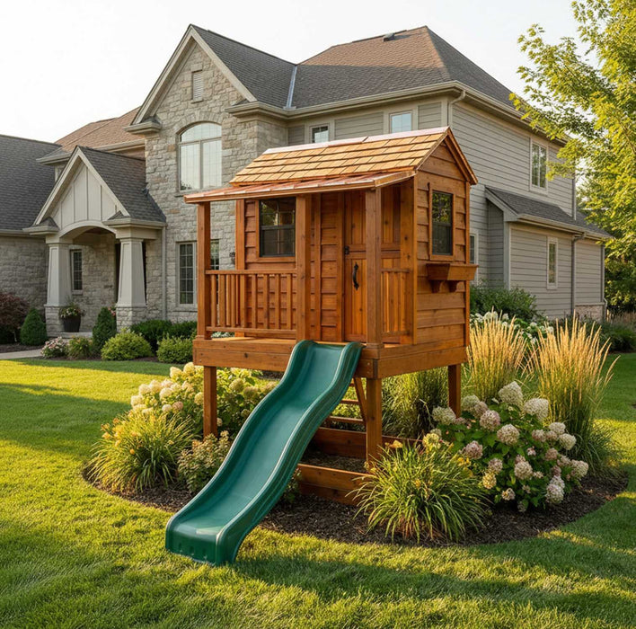 Little Cedar Playhouse 6x6 with wave slide positioned in front of a stone estate home
