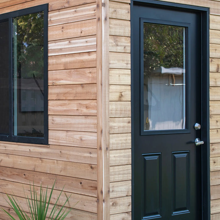 Single door entry with black trim on Outdoor Living Today Saltbox Studio Shed 12x8