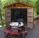 Riding mower parked in front of the open doors of Outdoor Living Today Space Master 8x12 wooden shed