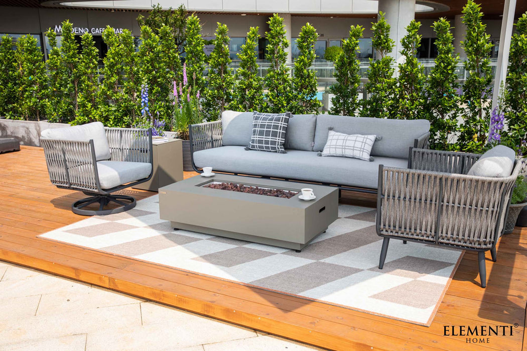 Elementi Milano Collection outdoor set showcased on a wooden deck with a cream and grey patterned rug, featuring a light grey sofa with patterned throw pillows, two matching grey rope swivel chairs with light cushions