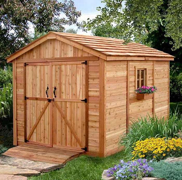 Outdoor Living Today Space Master 8x12 Wooden Shed with ramp in a garden setting