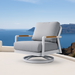 Stylish swivel chair from Elementi Outdoor Furnitures Santorini Collection with wooden armrests and panoramic sea view.