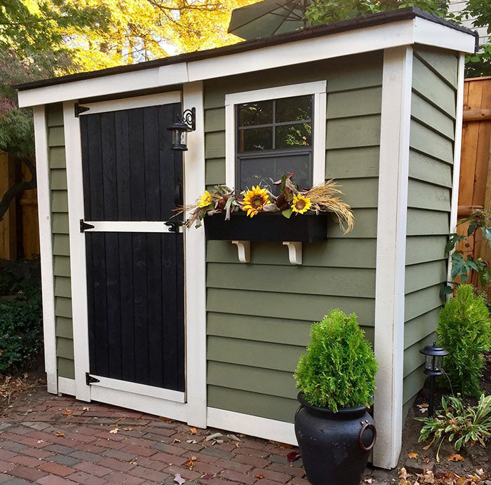 Outdoor wooden SpaceSaver 8x4 storage shed with a classic design, single door, and functional window for ventilation