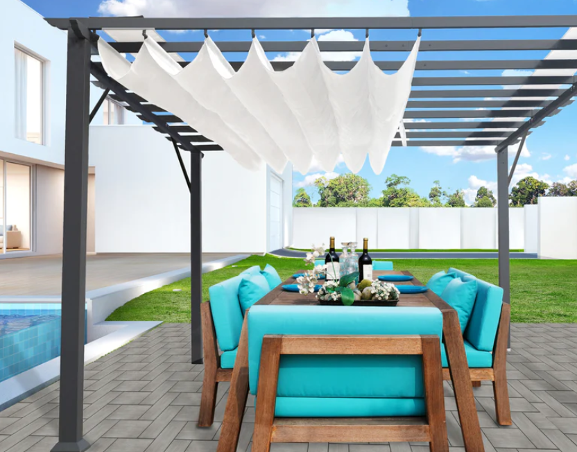 Paragon Outdoor Florence pergola with a gray frame and an off-white canopy, complementing an outdoor lounge area.