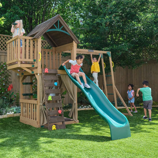 Children playing on the backyard clubhouse playset