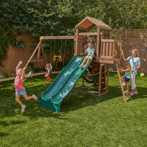 Kids playing on the playgroud with the vista swing set