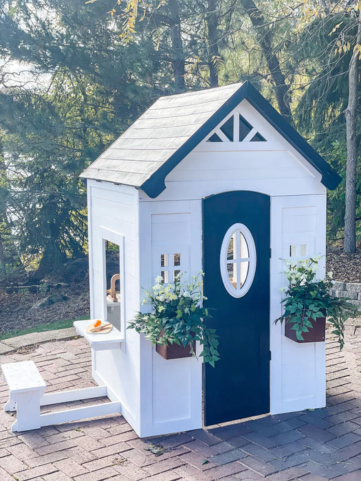 front & side angle of Zahara Playhouse outdoors
