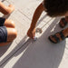 Close-up of kids playing with toy cars on the Lifetime playset tower floor's integrated car map design.