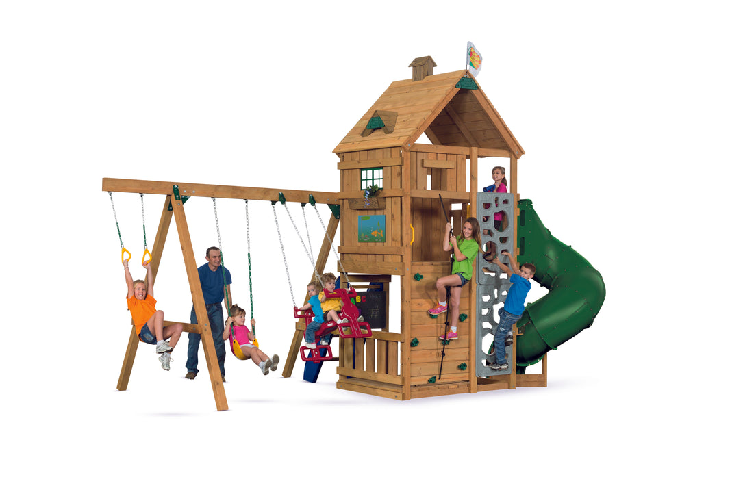 Kids enjoying the Playstar Ridgeline Gold Playset with swings, climbing wall, and spiral slide for backyard fun.