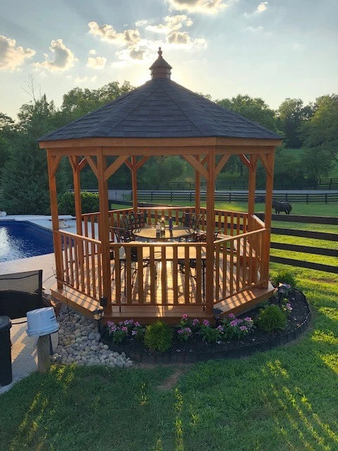 Amish 12 Foot Wood Gazebo-In-A-Box with Floor beside a pool