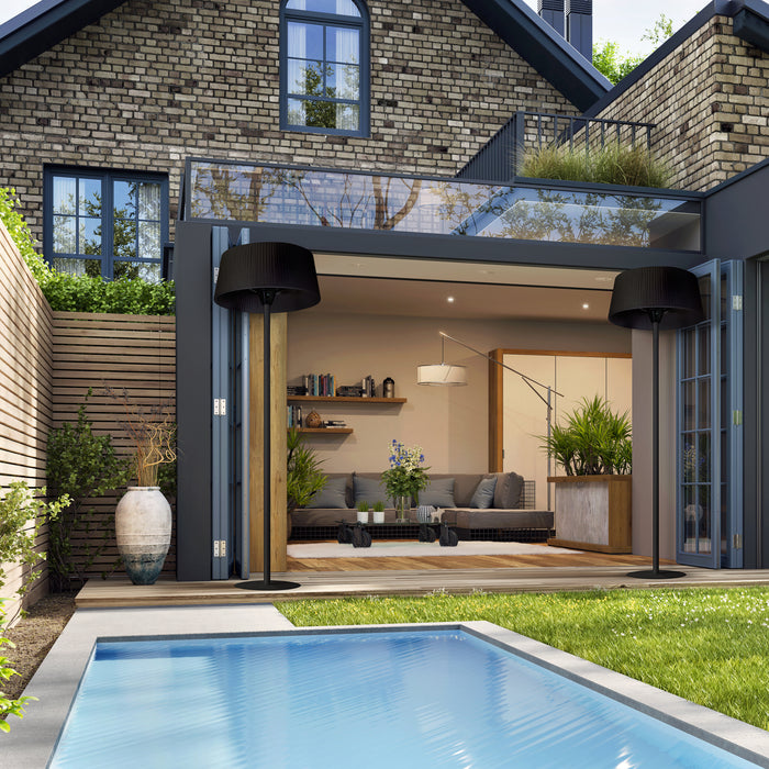 The Sol electric heater is featured poolside, connecting the indoor living space with the outdoor leisure area, enhancing the comfort of a luxury home.