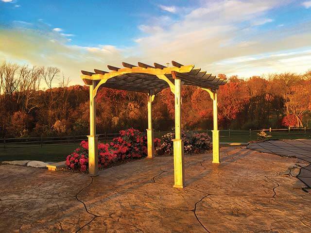Amish Gazebos Pergola on a ranch with flowers