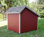 Back and side angle of EZ-Fit Playhouse Kit showing red wood panels, gray shingle roof and sturdy trim, backyard storage shed design