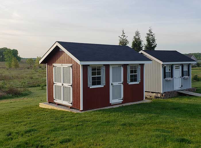 2 ez fit riverside sheds in a farm painted in red