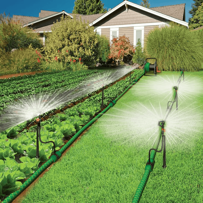 Riverstone Greenhouse Irrigation Systems installed in backyard garden with sprinkler heads watering vegetable rows