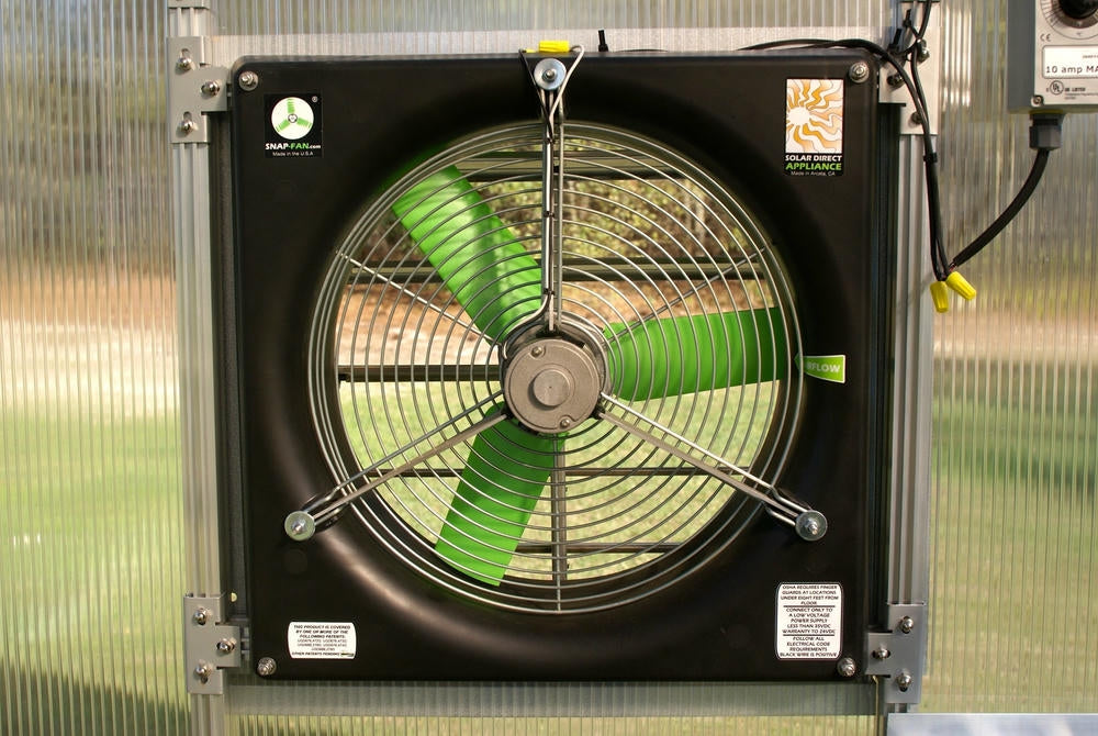 Close view of Riverstone MONT Solar Powered Ventilation System fan with protective grille and green blades.