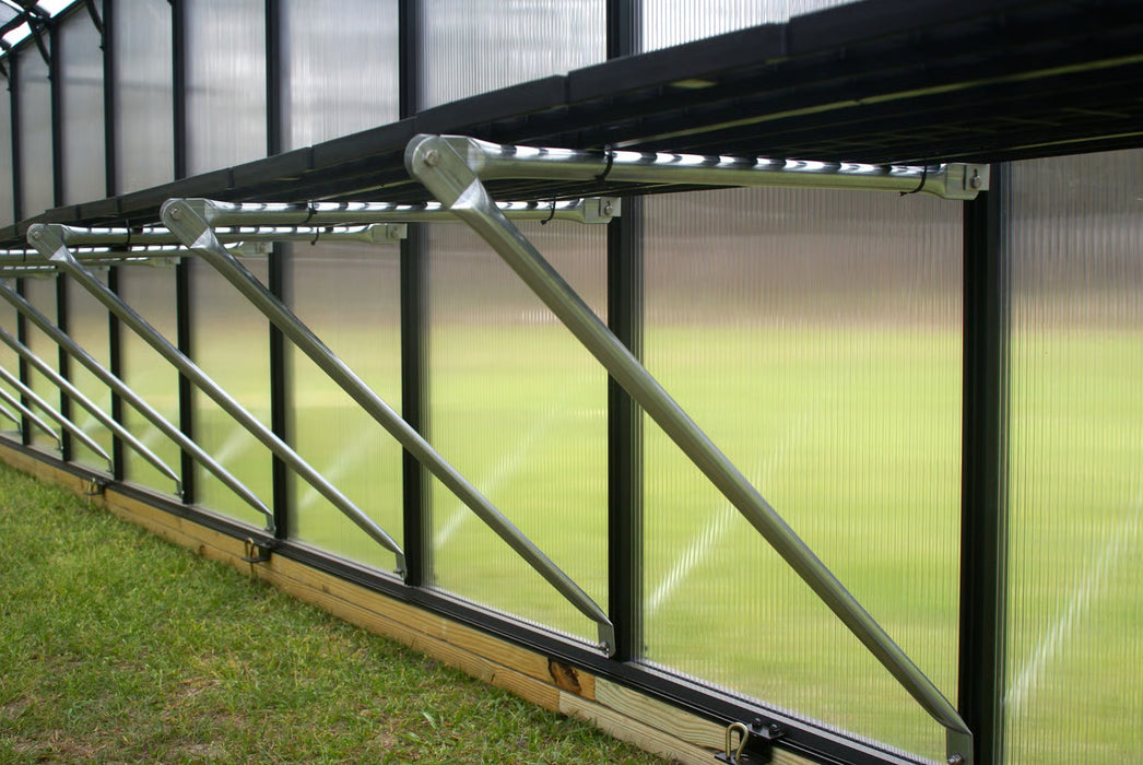 Interior side wall bracing of Riverstone MONT Greenhouse MOHEAT showing reinforced aluminum frame and panels