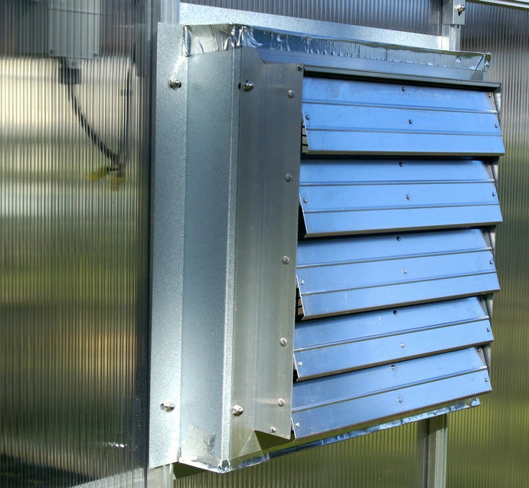 Exterior louver vent of Riverstone MONT Solar Powered Ventilation System installed on polycarbonate greenhouse panel.