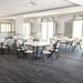 Wide view of Lifetime round folding tables and chairs arranged in a bright event room.