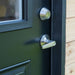 Close-up of black entry door and lock hardware on Saltbox Studio Shed 12x8