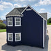 Side view of Sara’s Victorian Mansion playhouse by Little Cottage Co. in navy blue with white trim and multiple windows for natural light